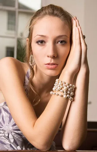 Pretty blonde girl with pearls