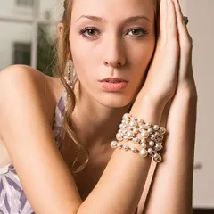 Pretty blonde girl with pearls