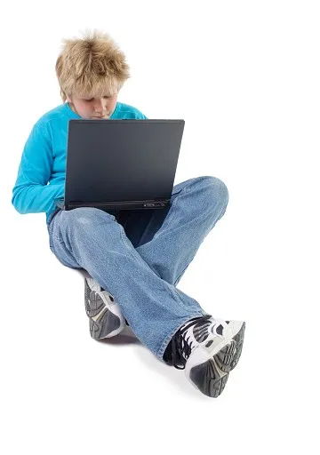Teenager boy with laptop
